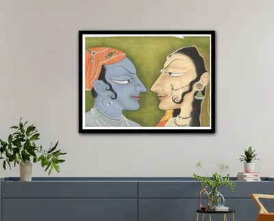 Radha Krishna paintings shown on a wall