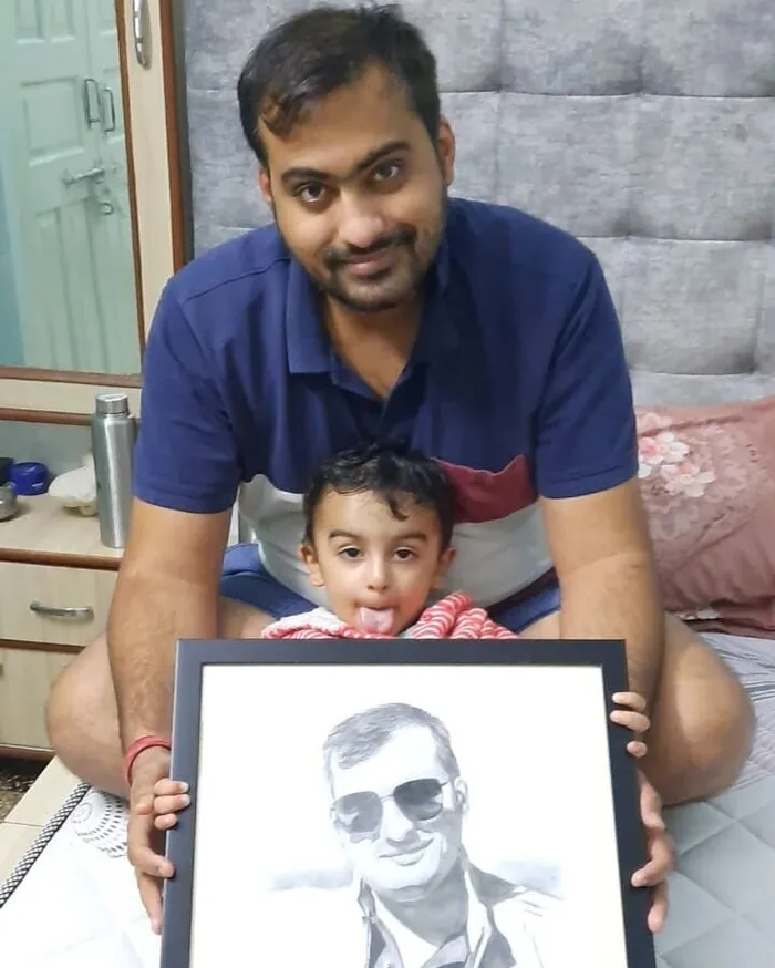 Sirish Dey with the pencil sketch from photo from Artshaili